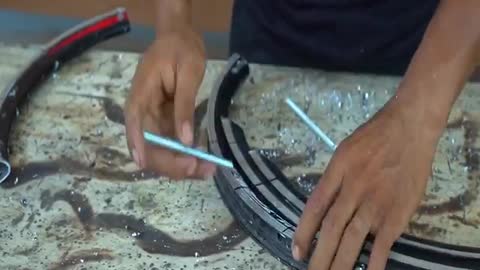 This Guy makes a Cool Bow out of Scrap Bicycle Rims