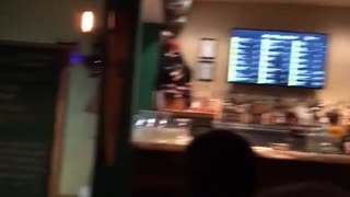 Cat gets carried out of bar