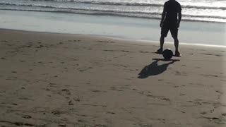Riding one wheel board on beach