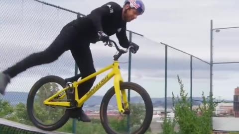 Guy Rides Bike On Tennis Net