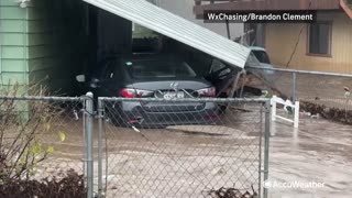 Houses collapse due to catastrophic flooding in Springville, California.