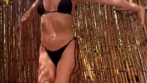 Heidi Klum enjoys outdoor shower in skimpy black bikini