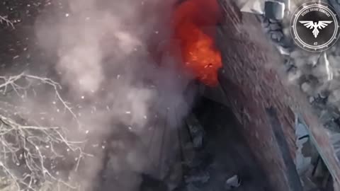 2 Russian soldiers without armour hiding next to a destroyed house are hit with an FPV drone