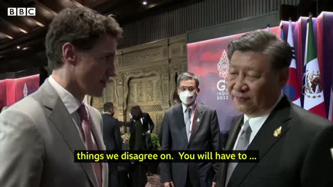 China and Canada leaders caught having tense exchange on camera - BBC News