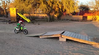 Kiddo Crashes Dirt Bike on Homemade Ramp
