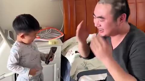 Cute baby playing with father