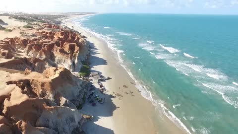 Droneview over a Sandy Beach Seaside Ocean