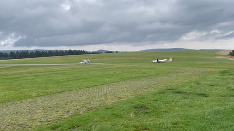 The moment a small plane takes off in the middle of nature