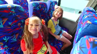 Diana and Roma share their school story on the bus