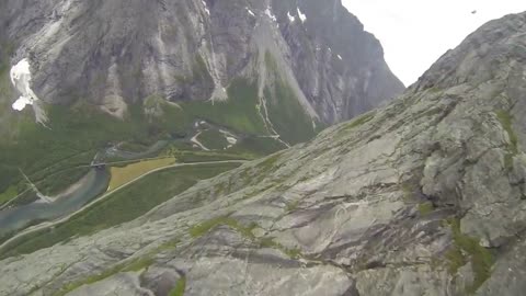 Point-of-view wingsuit flight over Norwegian cliffside