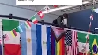 High schooler take the pride flag down