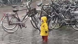 Cute Dutch children accepting the climate