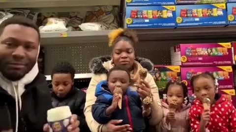 Idiot Black Father Eats Snacks Off The Floor Of A Grocery Store With His Baby Mom & Children!