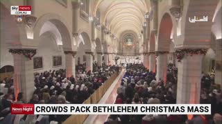 Crowds pack Bethlehem Christmas mass