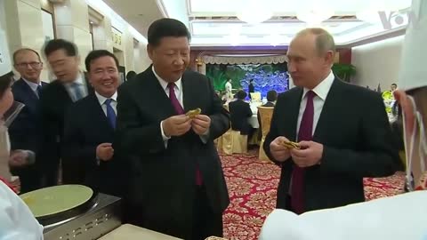 Russia's Putin and China's Xi Jinping learn to make Chinese