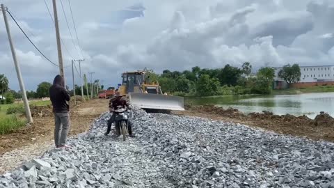 New bulldozer spreading gravel processing features building road foundation-16