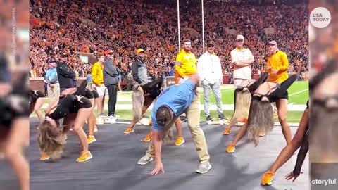Busted! Fake security guard dances during Tennessee football game | USA TODAY