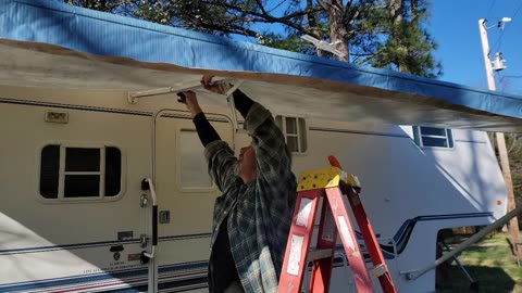 UNROLLING THE AWNING on our 2000 SUNNYBROOK after WINTER STORAGE