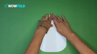 NONO - folding a paper airplane