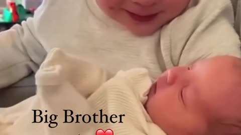 Cute boy reacts to meeting his little sister