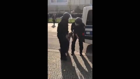 Update Video for Young German Girl Who Pushed Police Officer, Dragged Away Unconscious