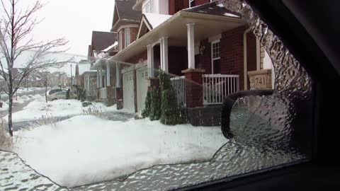 Ice storm. Smashing the car window.