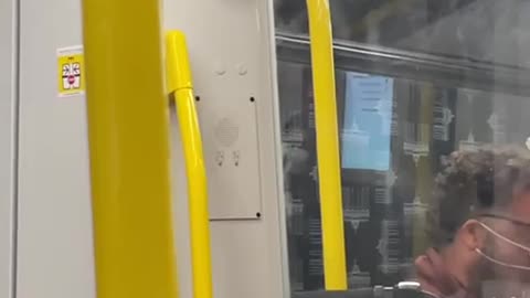 German idiot eating with mask in train