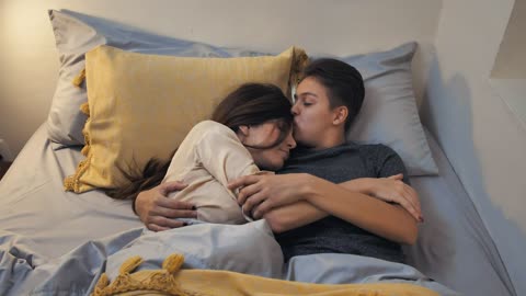 -couple-cuddling-in-bed-926-medium