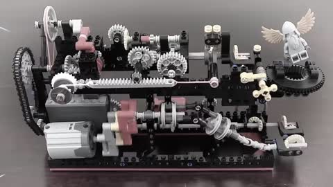 20 Mechanical Principles combined in a Useless Lego Machine