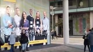 UK: Images of people murdered by the jab are stuck to the windows of the BBC..