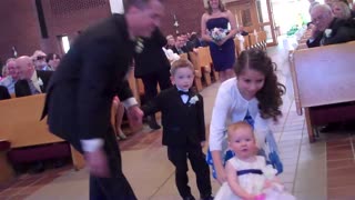 Baby Flower Girl Makes Unforgettable Wedding Entrance