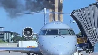 Old air traffic control tower at Charlotte Douglas Airport catches fire during demolition.