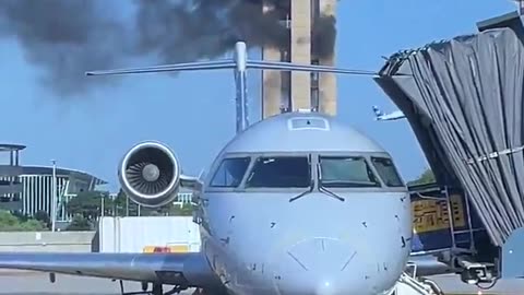 Old air traffic control tower at Charlotte Douglas Airport catches fire during demolition.