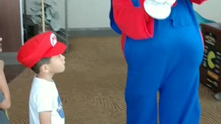 Houston mascot character Mario teaches how to get the coins by punching the mystery box