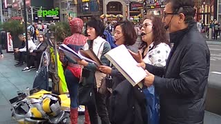 Singing hymns at 42nd Street and Broadway NY NY.