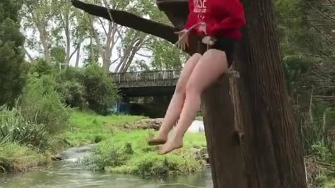 chick attempts to swing out of tree, doesn't quite make it