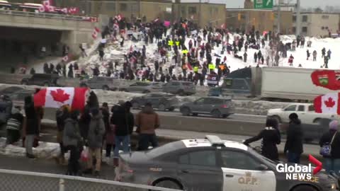 Trucker convoy: People line bridges in Greater Toronto Area as trucks roll through