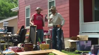 Bassmaster Mumbling at a Garage sale.