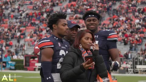 Auburn seniors receive game balls from interim head coach Cadillac Williams on senior day