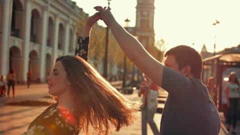 Man and woman romantic dance in Roma by the sunset