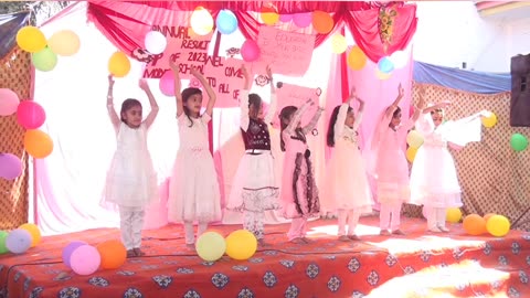 Little girls performing welcome performance on annual day