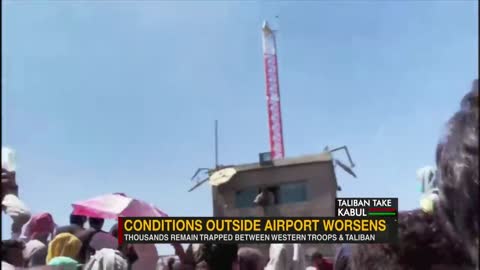 Desperate Afghans queue in sewage-filled canal outside Kabul airport