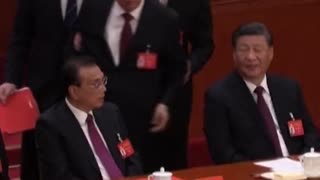 Hu Jintao: ex-president escorted out of China party congress