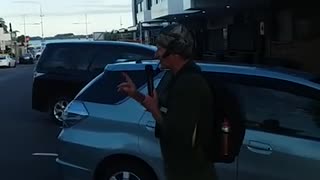 Angry heckler grabs street preacher around the neck while preaching at Tauranga