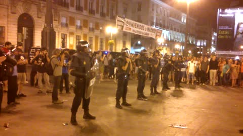 Elderly Man In Wheelchair Trolling Riot Police