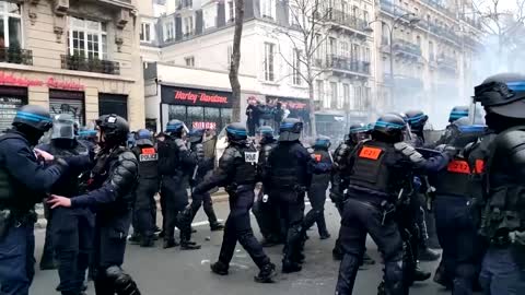 Protesters hurl fireworks, police deploy tear gas at Paris protest