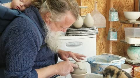 Cat Plays With Pottery Wheel