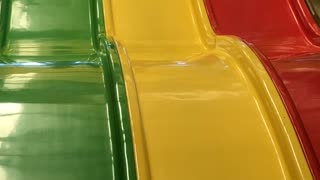 Woman and Child Take a Tumble on the Slide