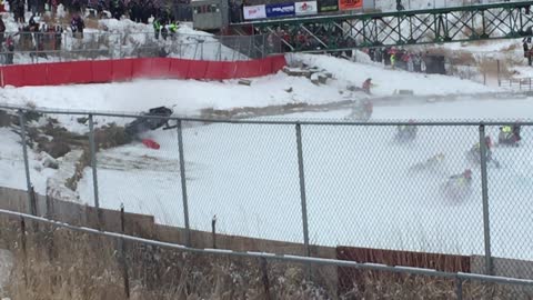 Intensely dangerous crash during snowmobile race