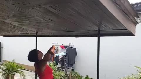 Lady yells greetings to her neighbors during quarantine